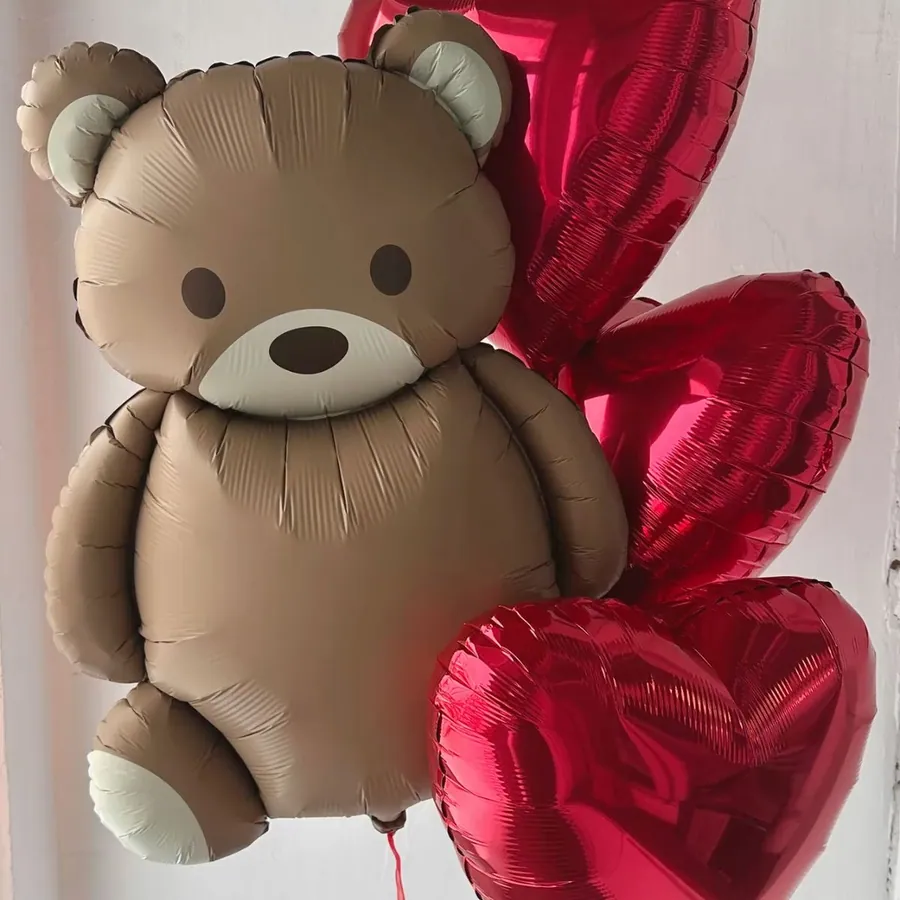 Teddy bear and red hearts